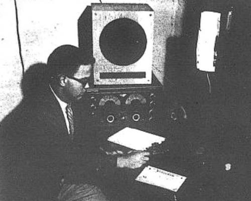 Yale Radio Club president James Douglas ('55),operates W1YU in the basement of Hendrie Hall in this photograph published in the Yale Daily News on 9/30/53.