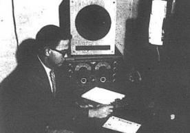 Yale Radio Club president James Douglas ('55),operates W1YU in the basement of Hendrie Hall in this photograph published in the Yale Daily News on 9/30/53.